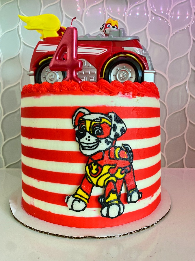 Buttercream cake with a piped Ninja Turtle portrait and a brick wall border